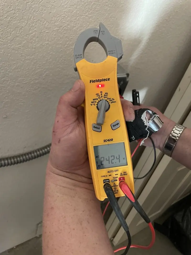 Voltage testing with clamp meter during Aluminum Wiring Replacement in Addison